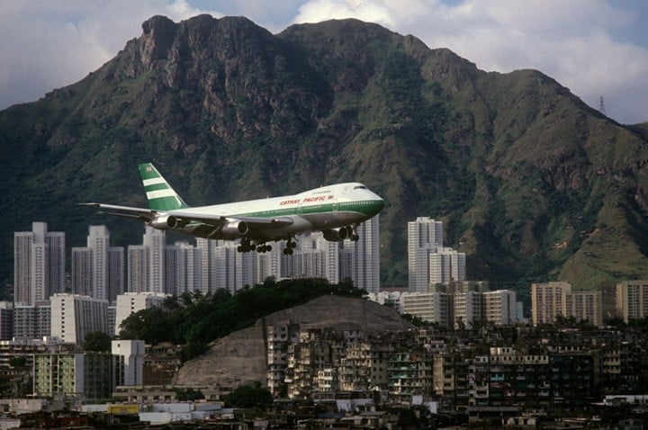 Greg Girard, Cathay Pacific 747 with Lion Rock and Kowloon Walled City. 1989